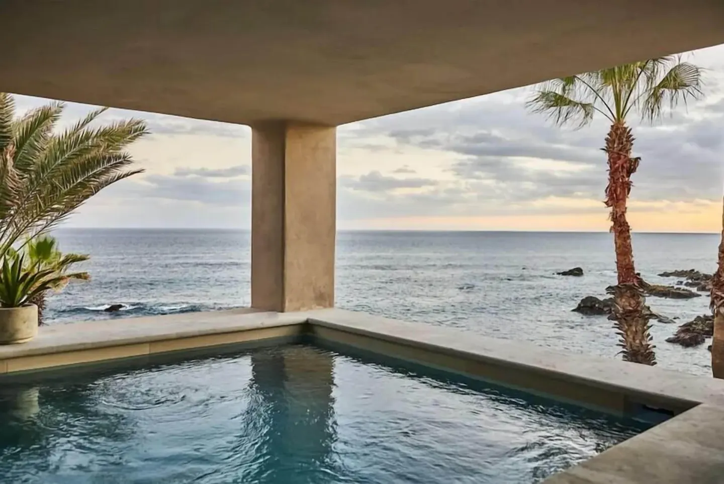 Private plunge pool facing the ocean and rocky shoreline at Esperanza.