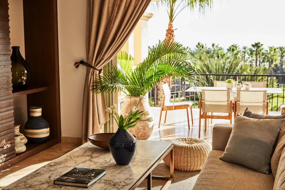 Living room sofa and terrace seating with palm views in an ocean view casona at Esperanza.