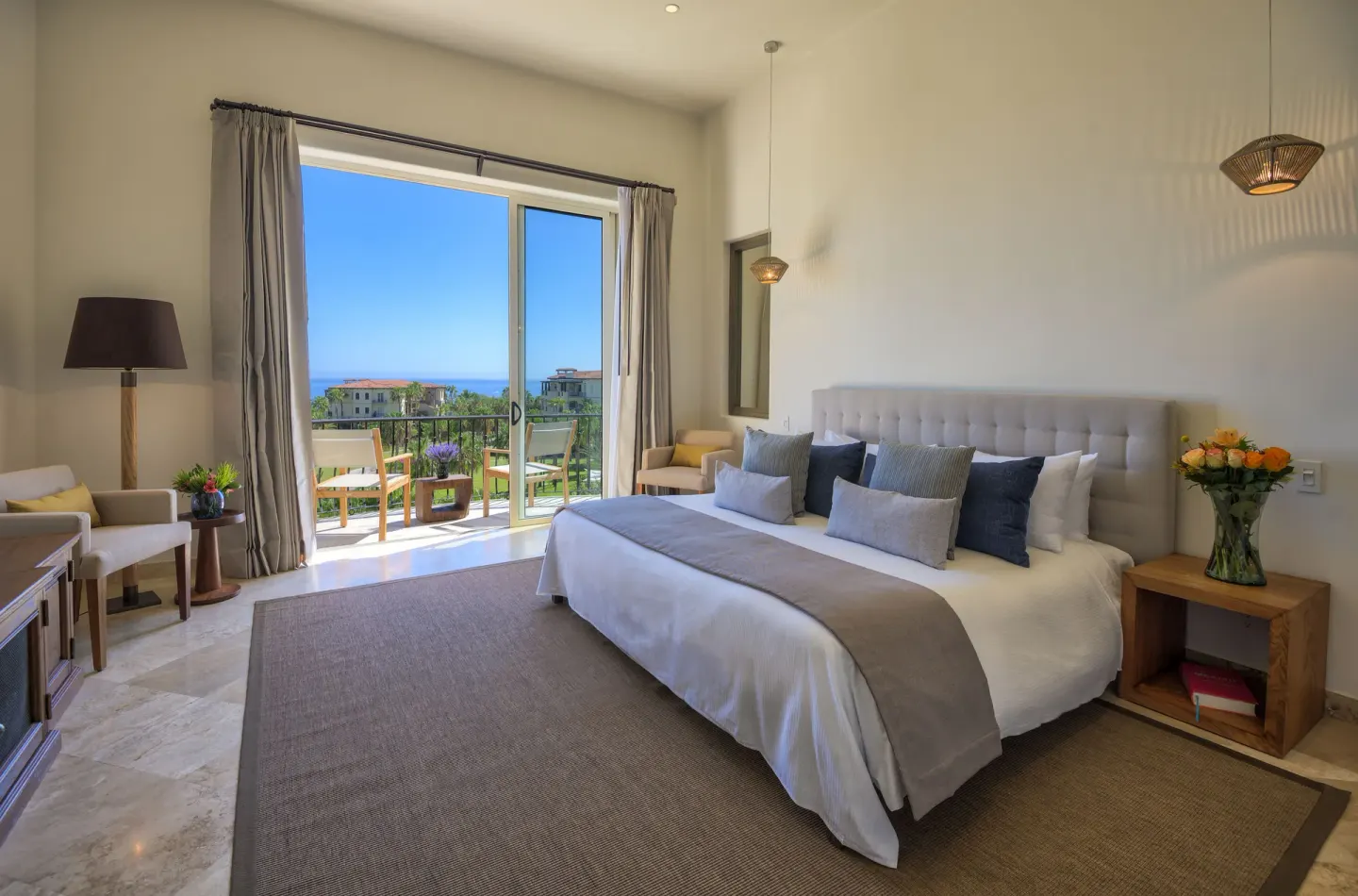 King bed guest room with balcony and ocean view at Esperanza.