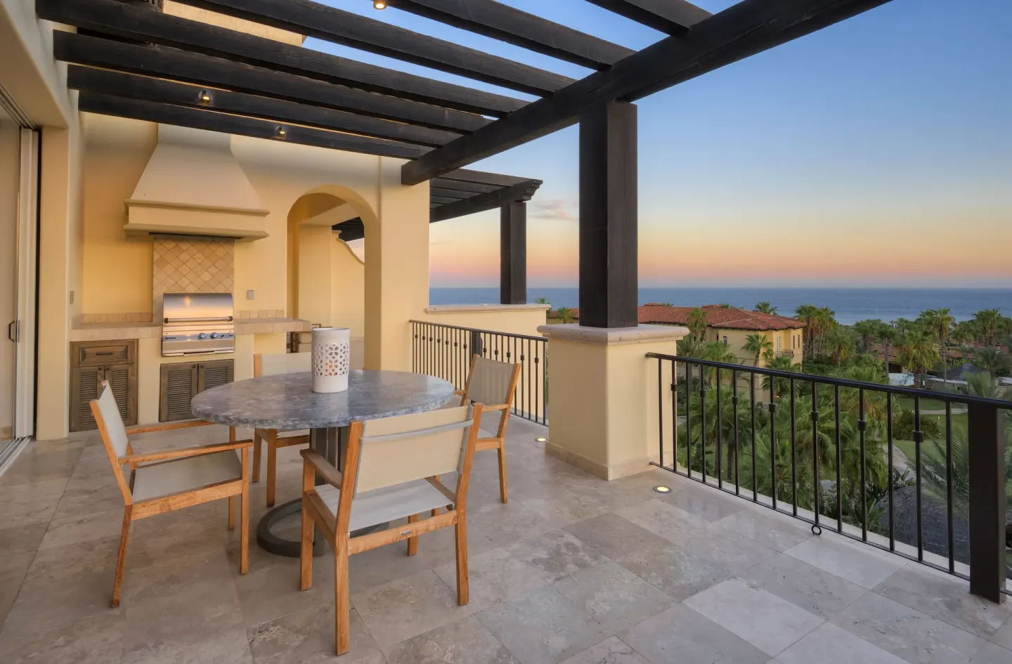 Private terrace with dining table, grill, and ocean view at Esperanza.