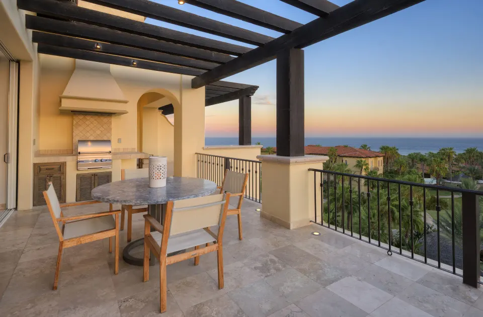 Private terrace with dining table, grill, and ocean view at Esperanza.