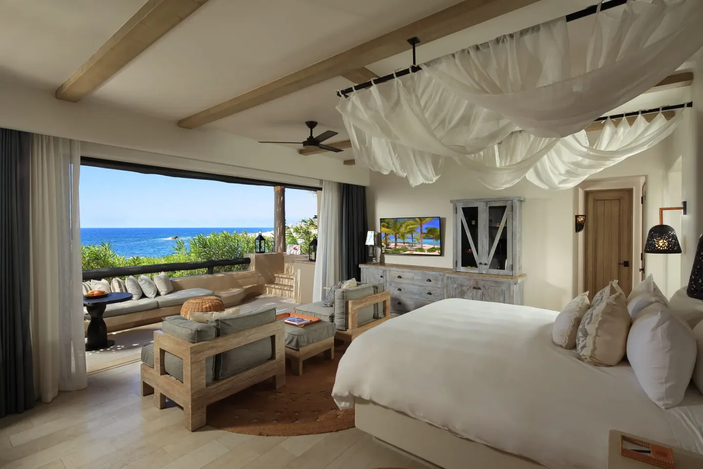 Oceanfront spa casita guest room with king bed and sea-view terrace at Esperanza.