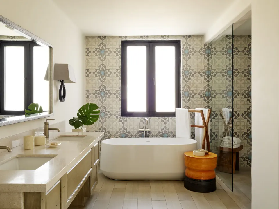 Studio Ocean View bathroom with soaking tub and glass shower at Esperanza.