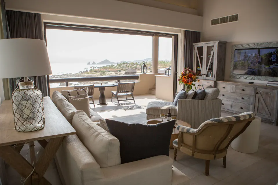 Penthouse Spa Suite living room with ocean-view balcony at Esperanza.