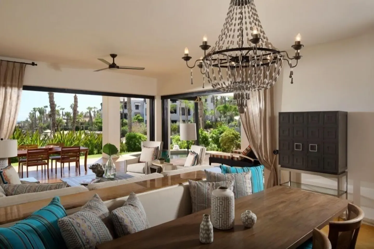 Villa garden-view living and dining area with terrace at Esperanza.