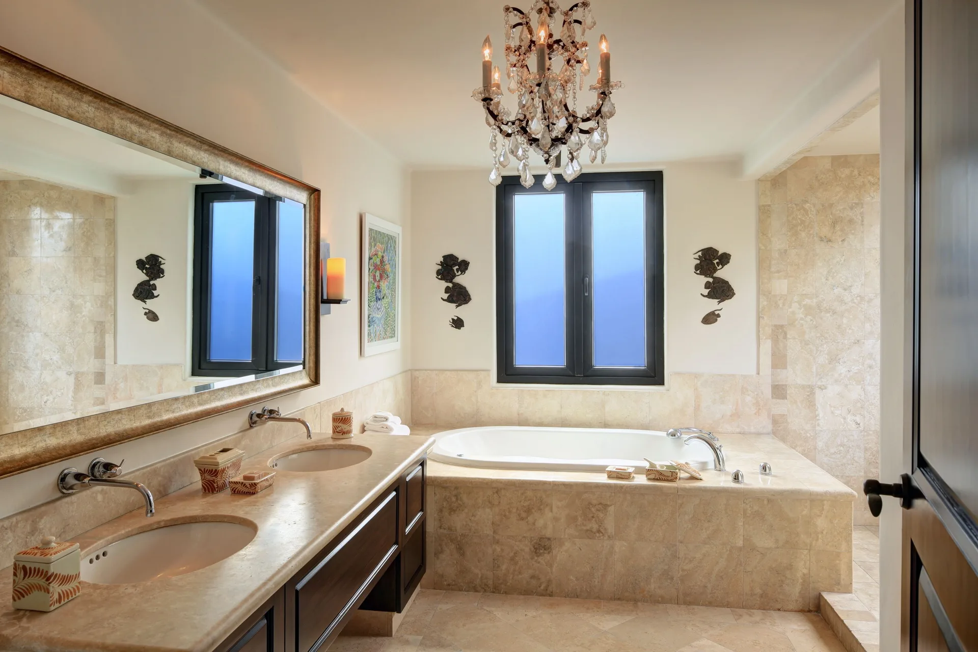 Oceanfront villa bathroom with soaking tub and chandelier at Esperanza.