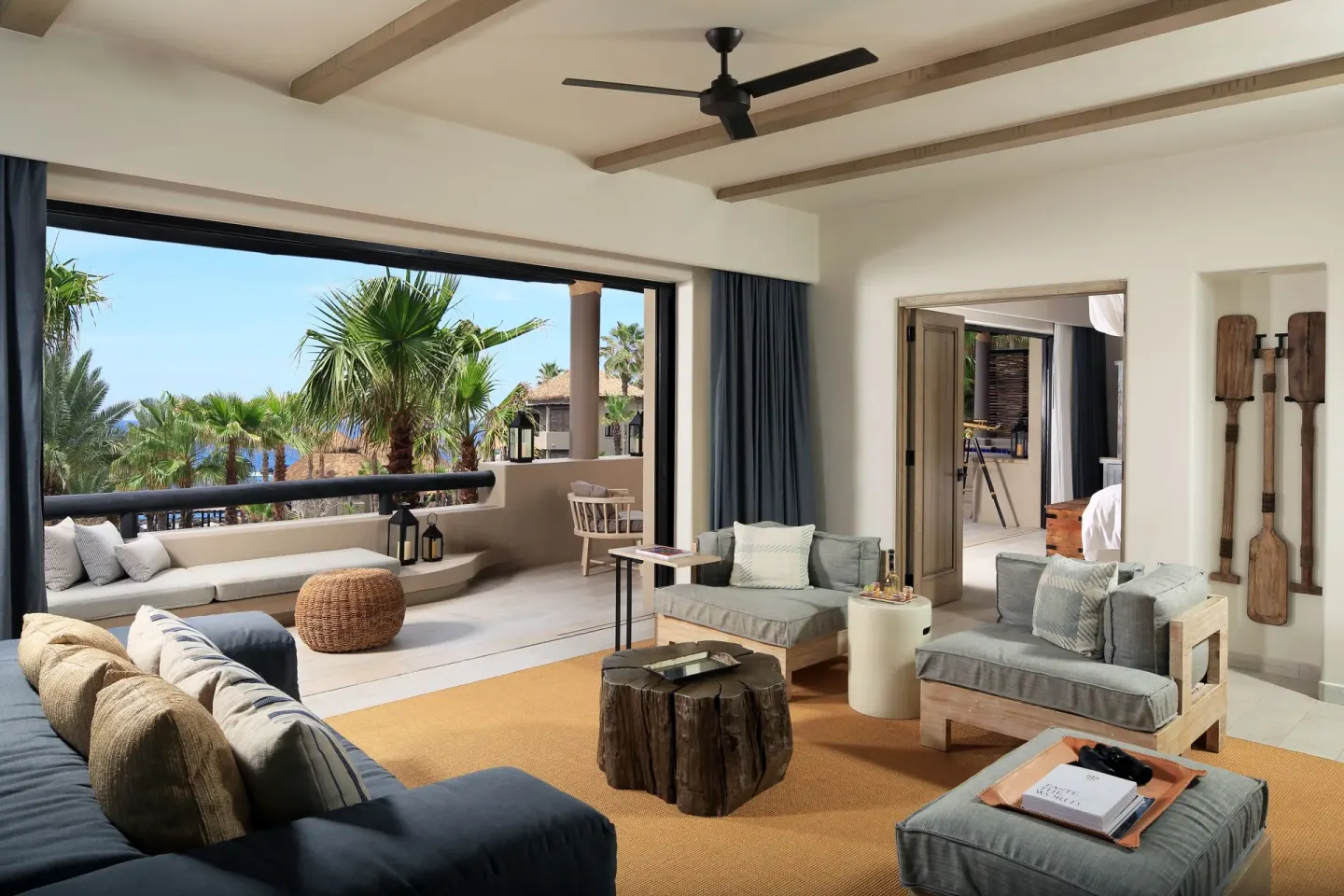 Oceanfront villa sitting room with terrace and palm views at Esperanza.