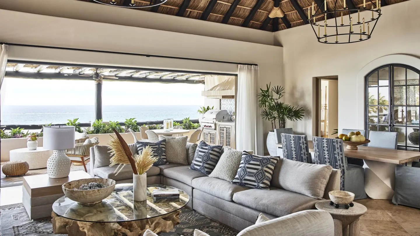 Oceanfront villa living room with terrace seating at Esperanza.