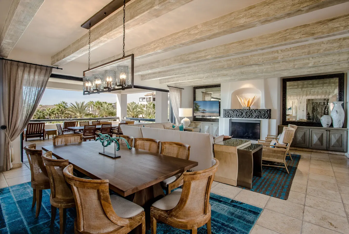 Ocean-view villa dining and living room with terrace seating at Esperanza.