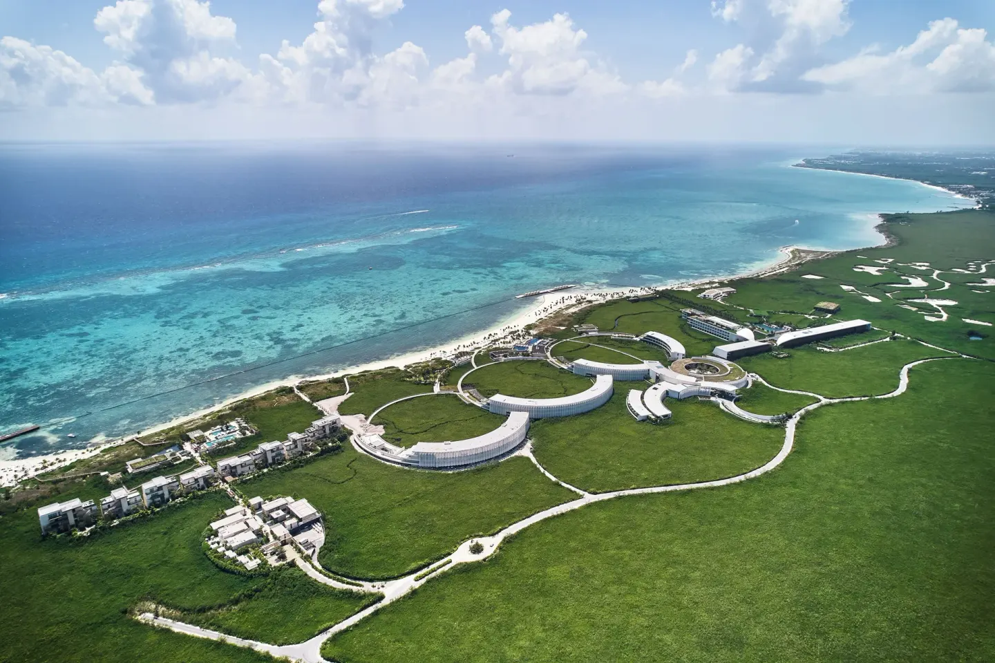 Aerial view of the beachfront resort and turquoise sea at Etéreo, Auberge Collection.