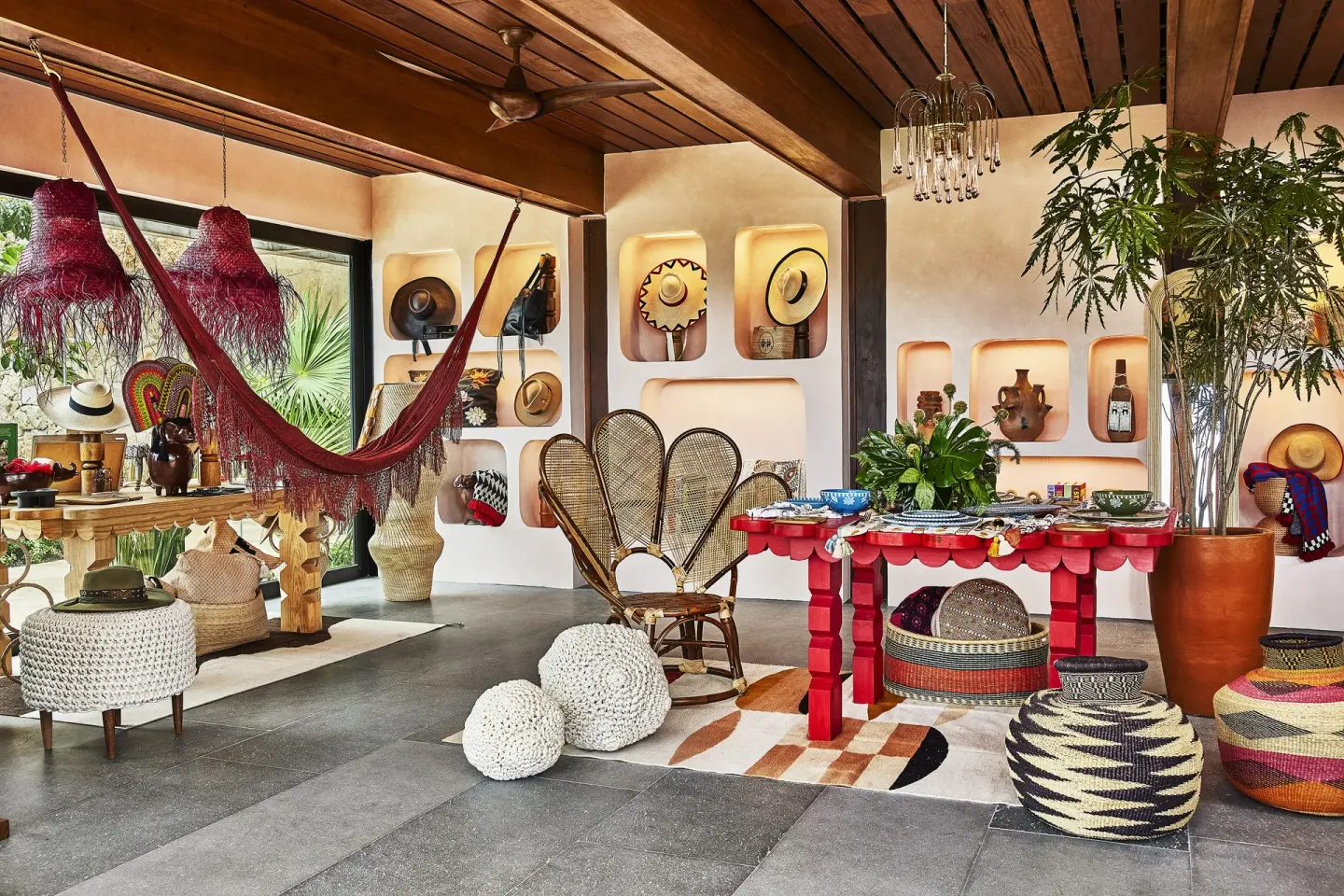 A colorful boutique display with hammocks and woven decor at Etéreo, Auberge Collection.