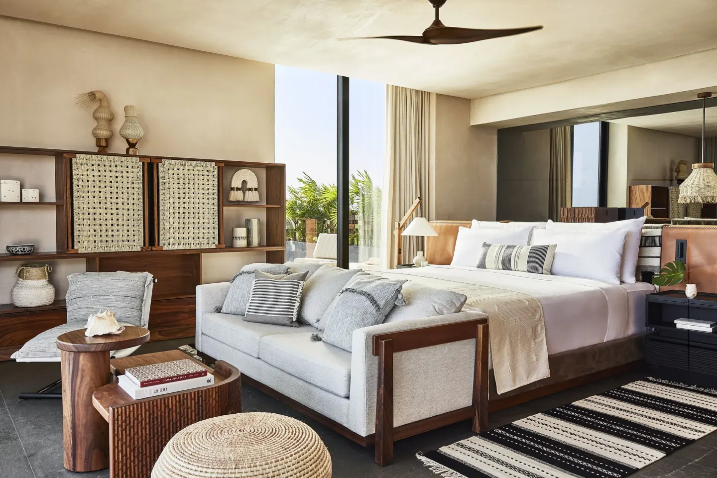 Ocean Studio king bed and sitting area at Etéreo, Auberge Collection.