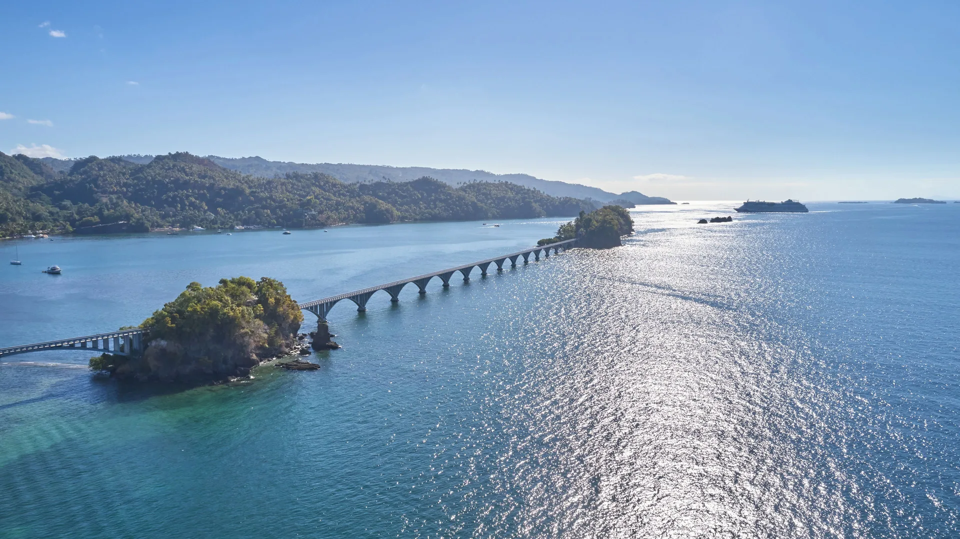 Aerial bay view with arched bridge and forested islets at Eurostars Grand Cayacoa.