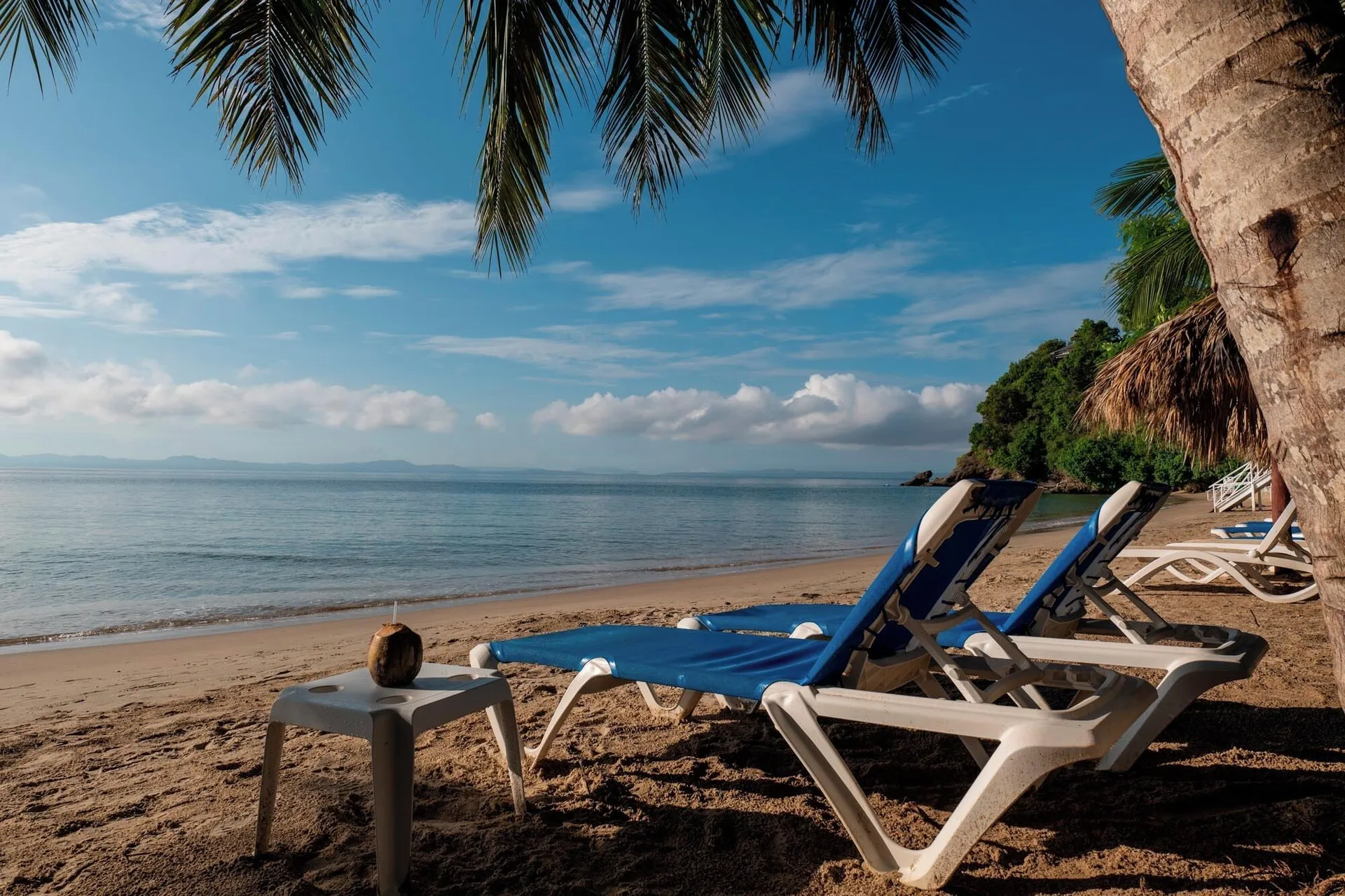 Blue loungers facing the calm beach at Eurostars Grand Cayacoa.