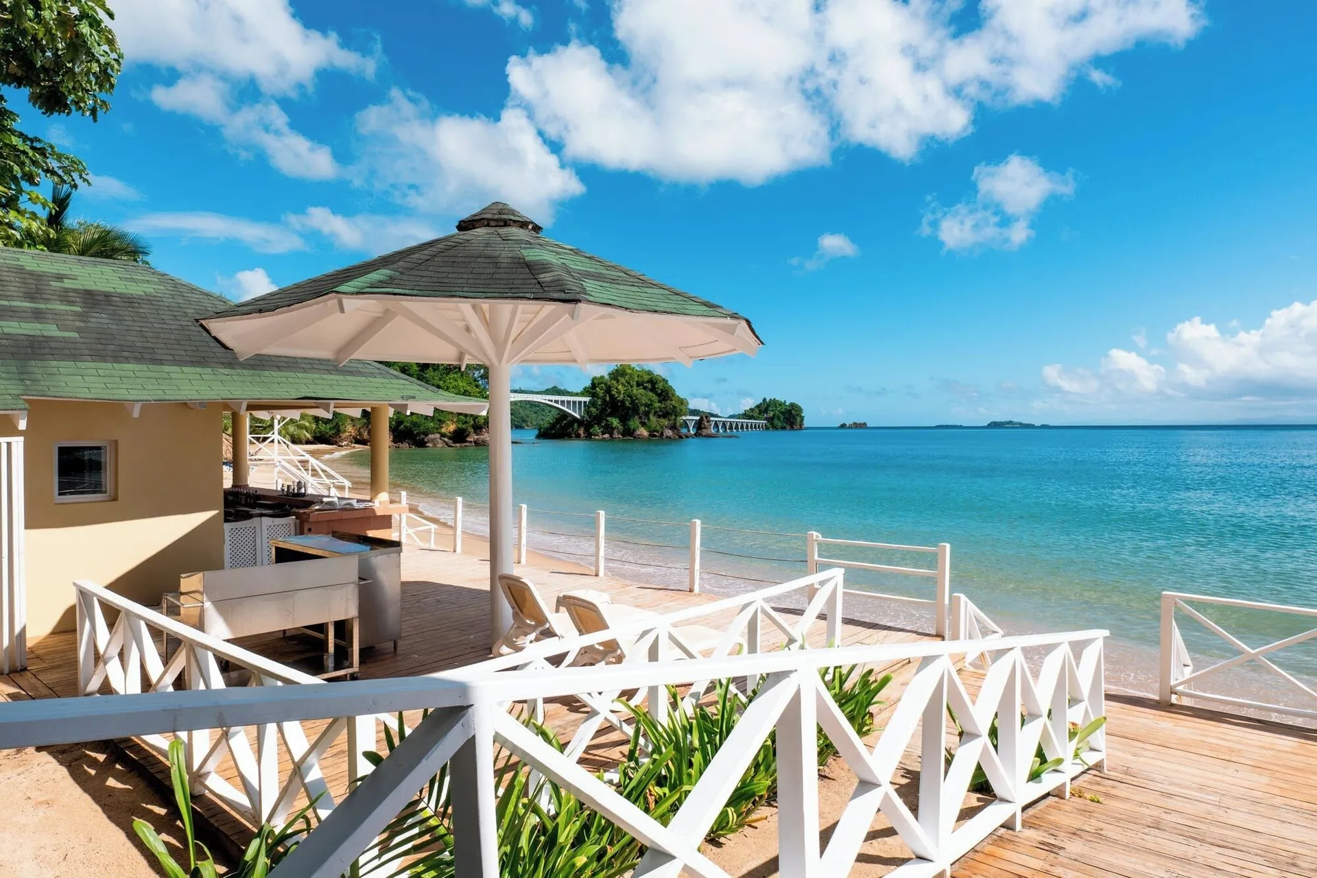 Beachside deck and turquoise water at Eurostars Grand Cayacoa.