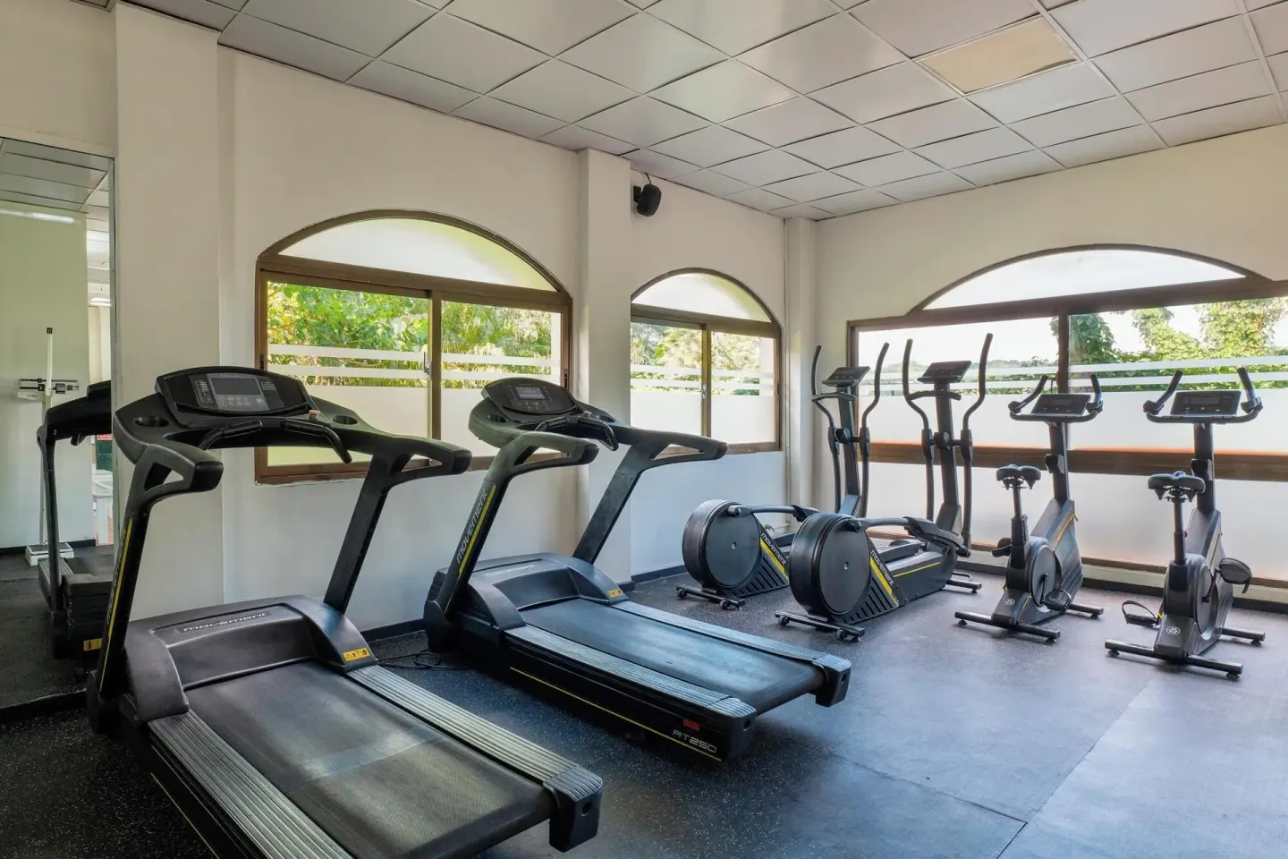 Fitness room with treadmills, bikes, and ellipticals at Eurostars Grand Cayacoa.