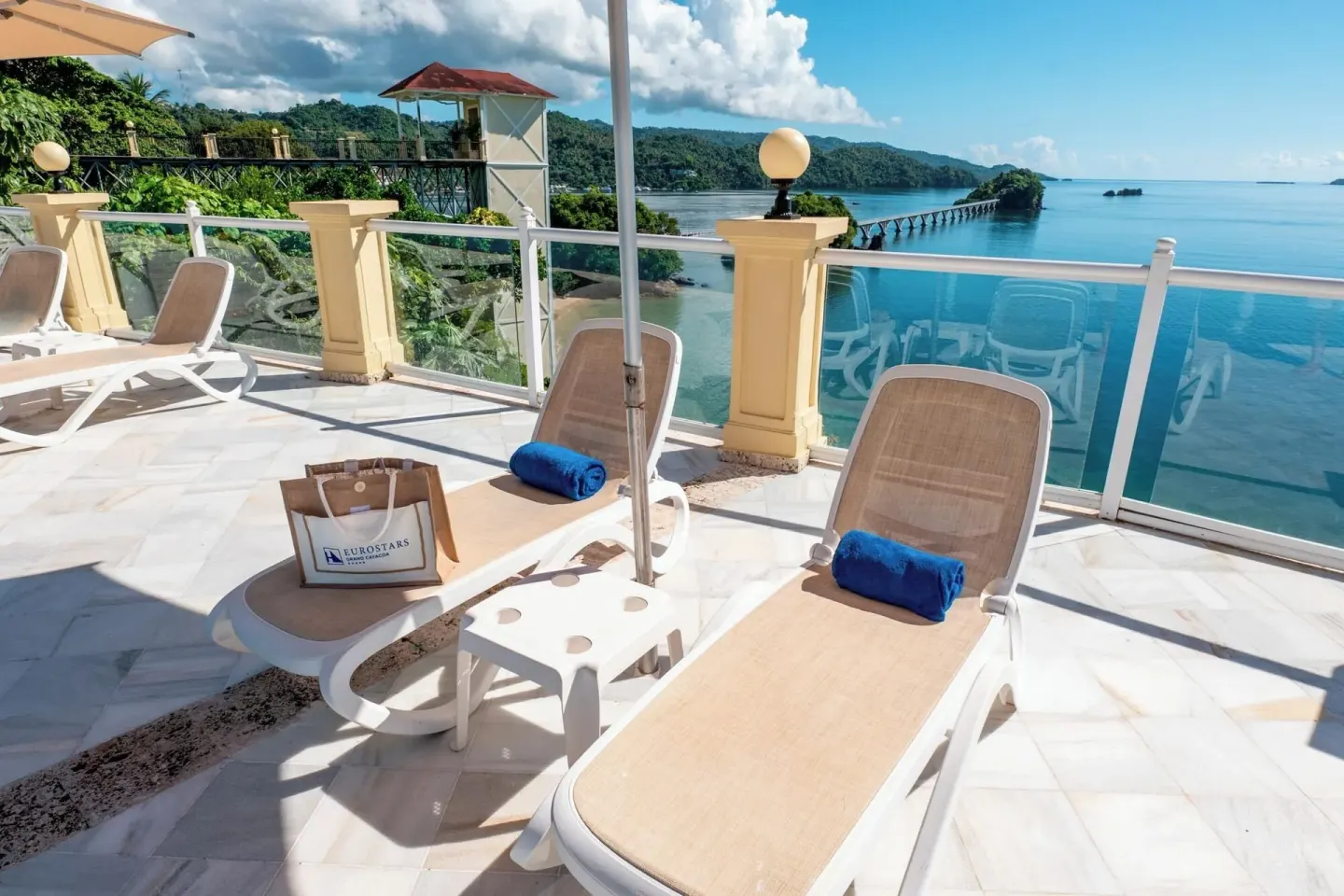 Sun loungers on an oceanview terrace at Eurostars Grand Cayacoa.