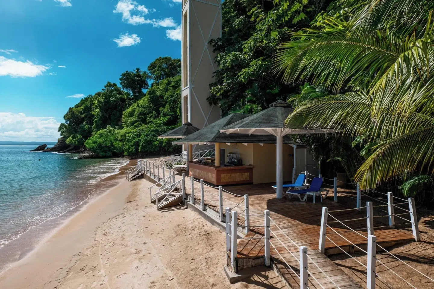 Beach bar deck beside the sand and water at Eurostars Grand Cayacoa.