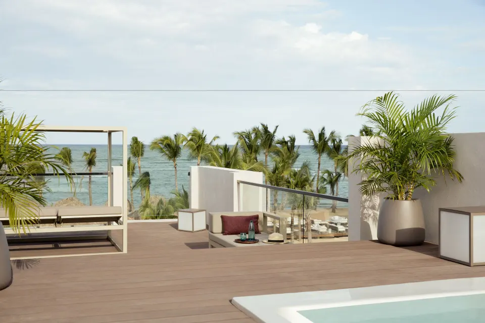 Rooftop terrace plunge pool with ocean and palm views at Excellence El Carmen