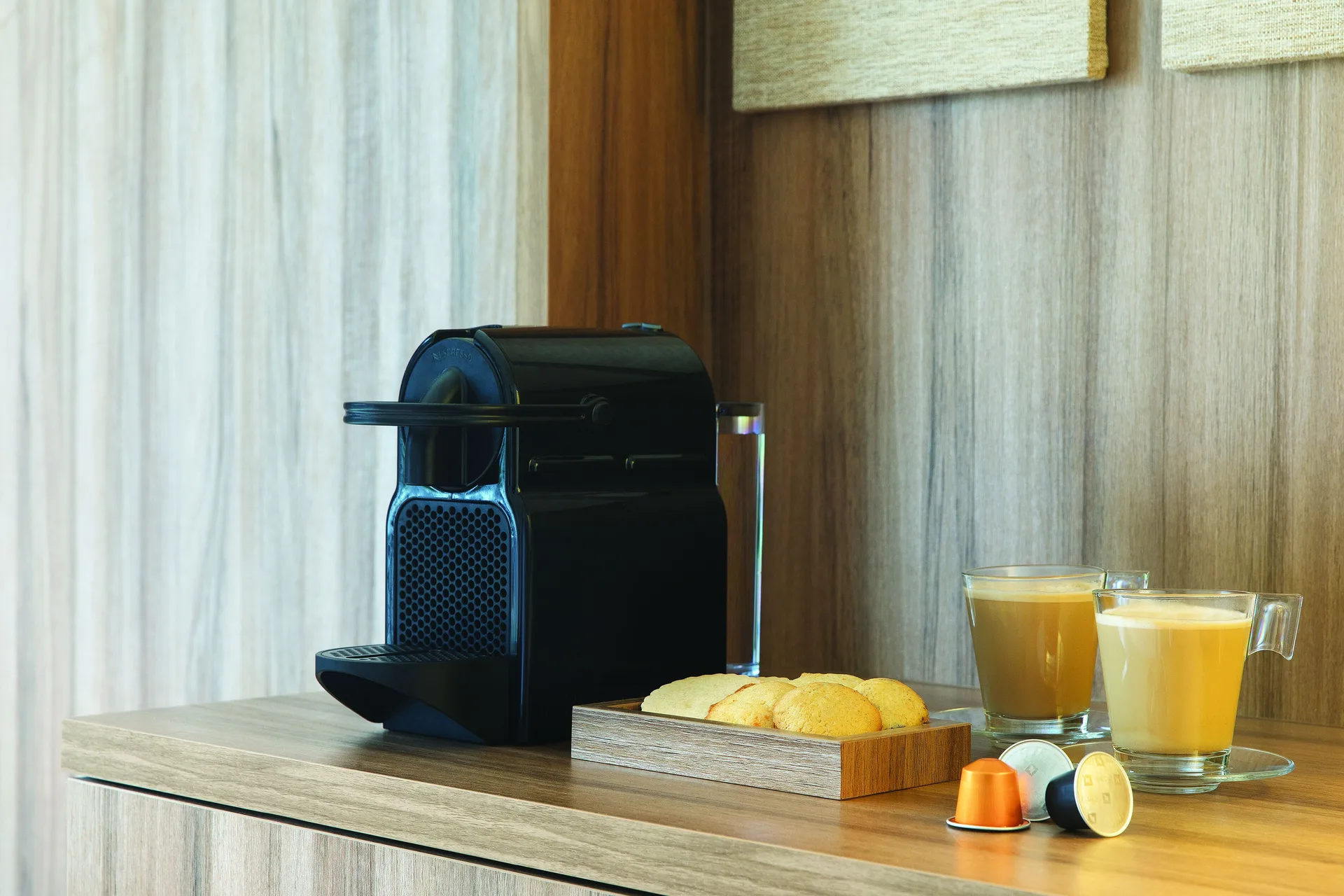 In-room coffee machine with pastries and drinks at Excellence El Carmen.