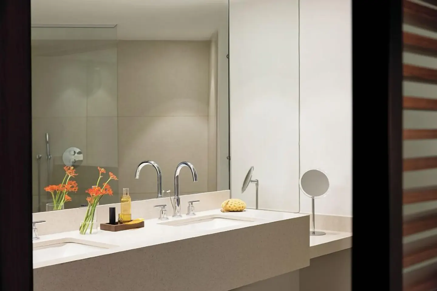 Junior Suite Pool View bathroom vanity with double sinks at Excellence El Carmen.