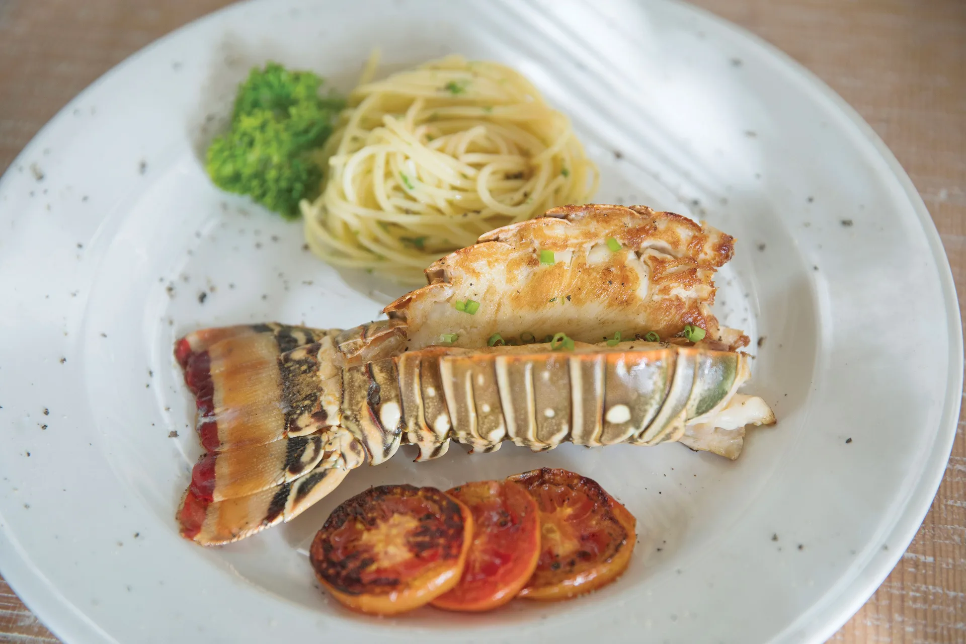 Grilled lobster tail with pasta and tomatoes at Excellence Playa Mujeres.