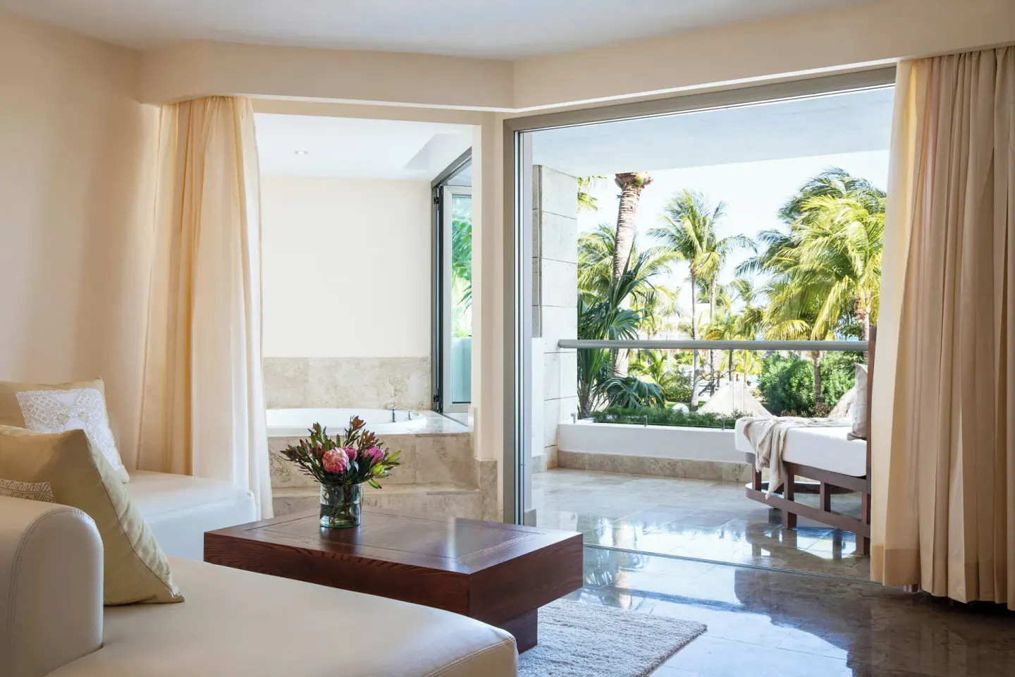 Junior Suite Spa or Pool View sitting area, terrace, and outdoor tub at Excellence Playa Mujeres.