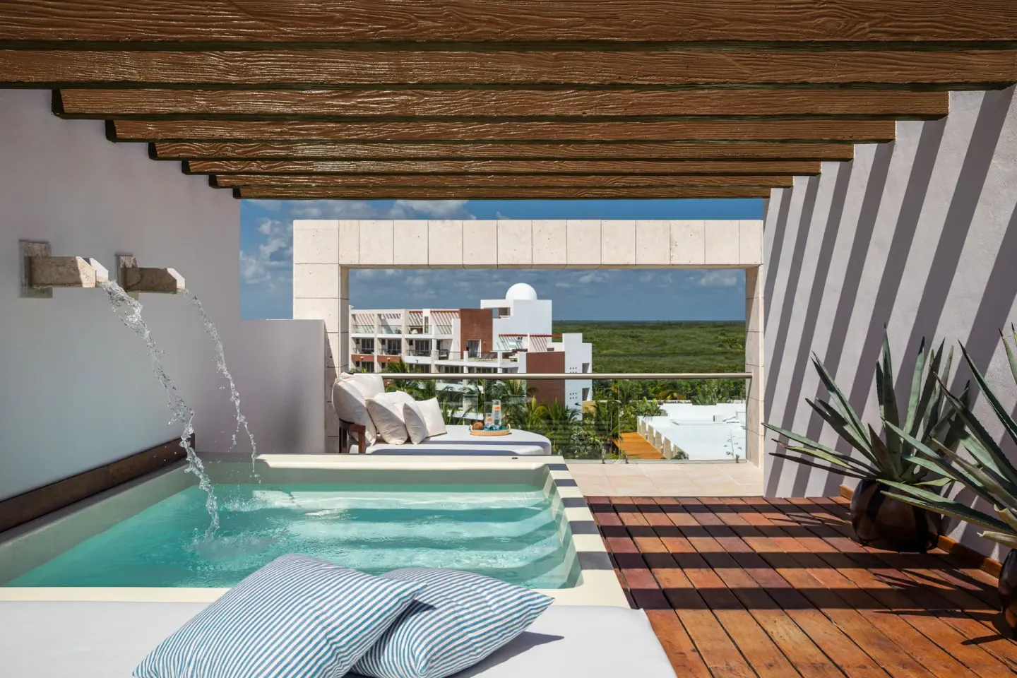 Private rooftop plunge pool and loungers in a Two-Story Rooftop Terrace Suite at Excellence Playa Mujeres.