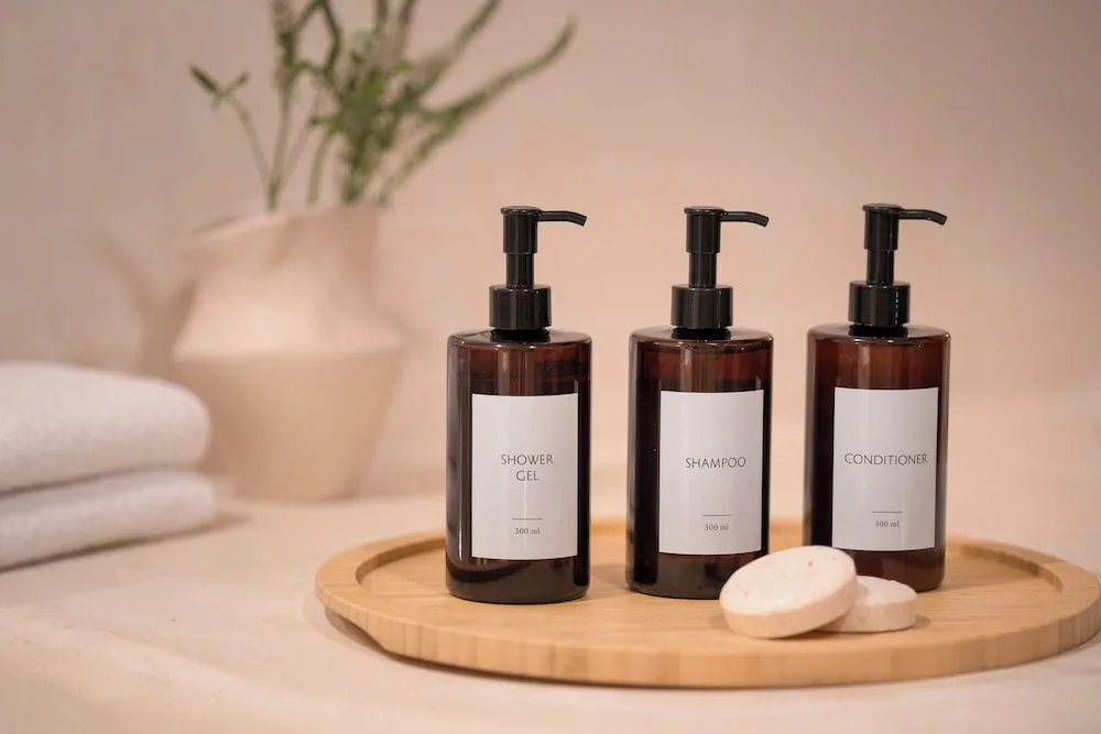 Bathroom amenities on a tray with towels and soap at Excellence Punta Cana.