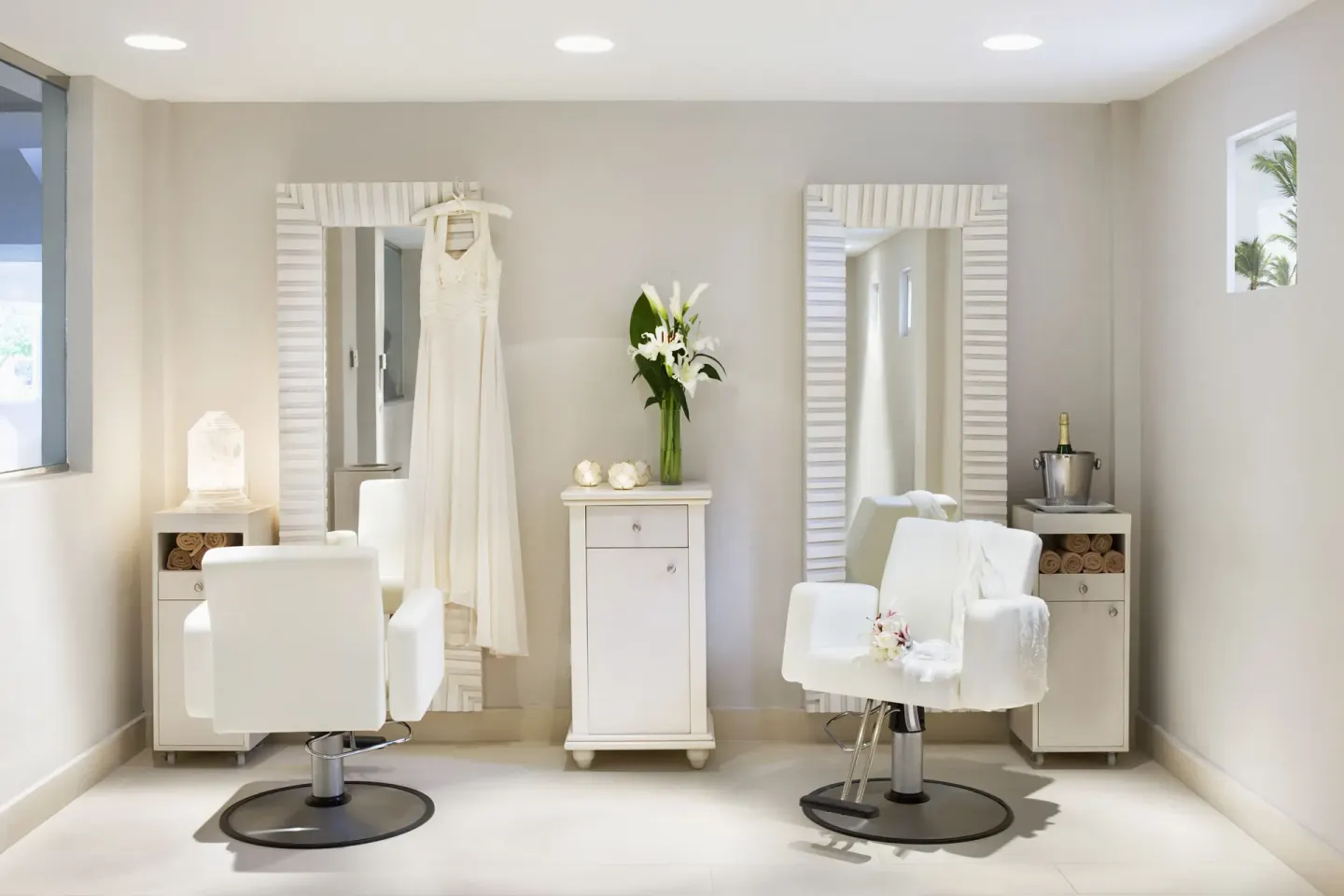 Bridal salon with white styling chairs and mirrors at Excellence Punta Cana.