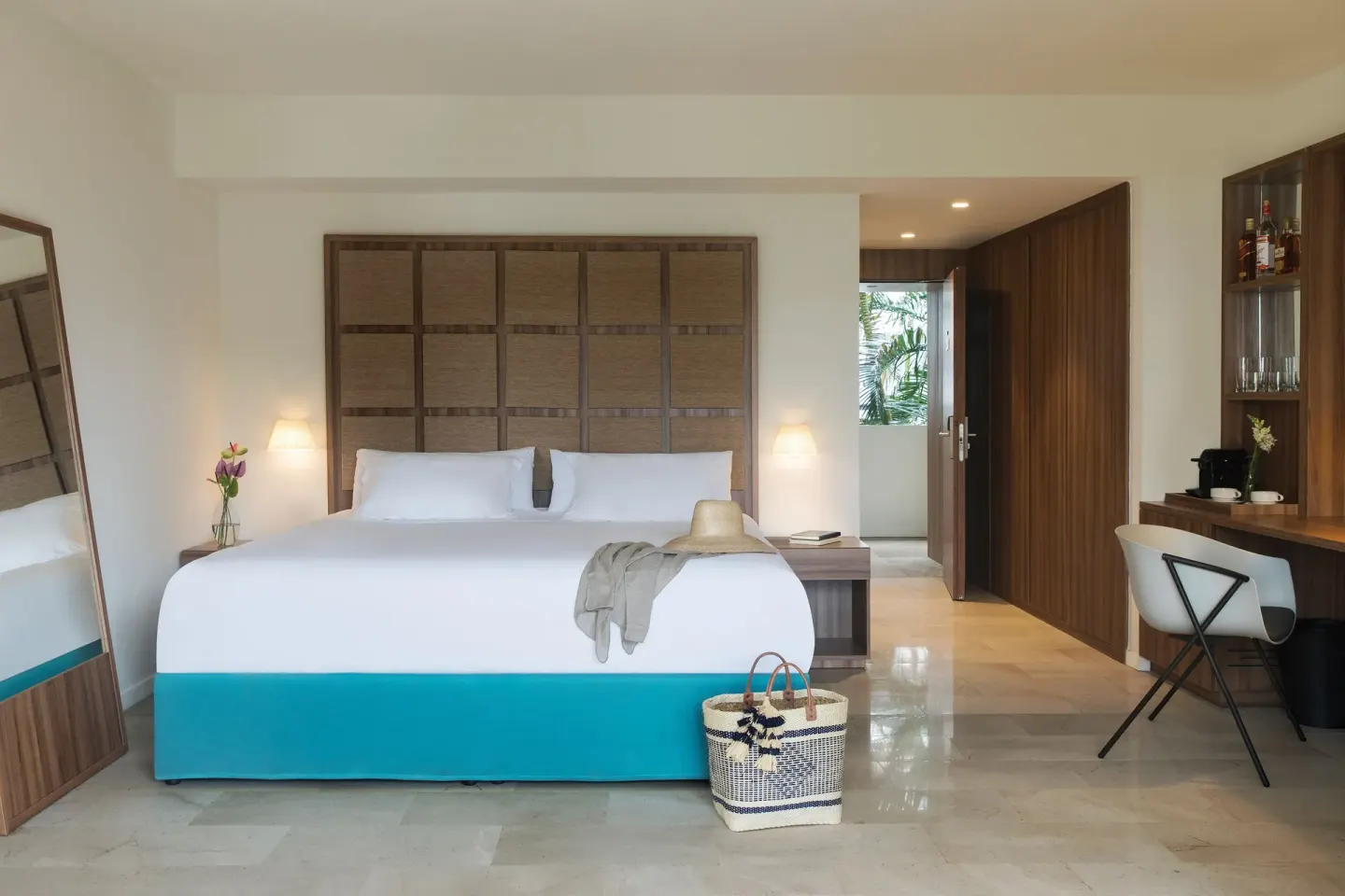 Junior Suite Garden or Mountain View king bed and desk at Excellence Punta Cana.