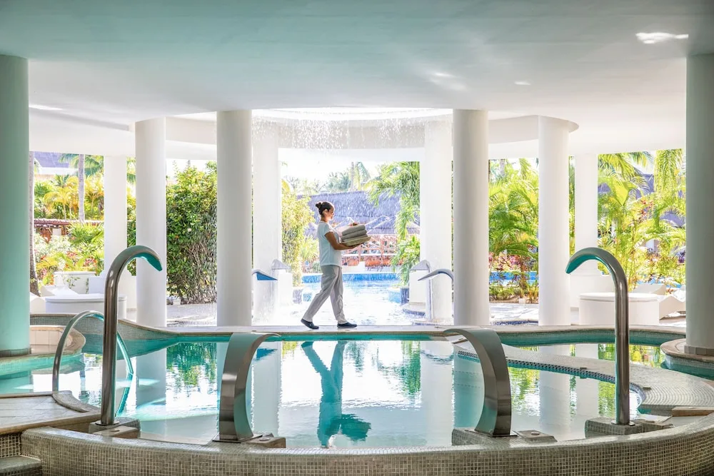 Spa hydrotherapy pool area with columns at Excellence Riviera Cancun.