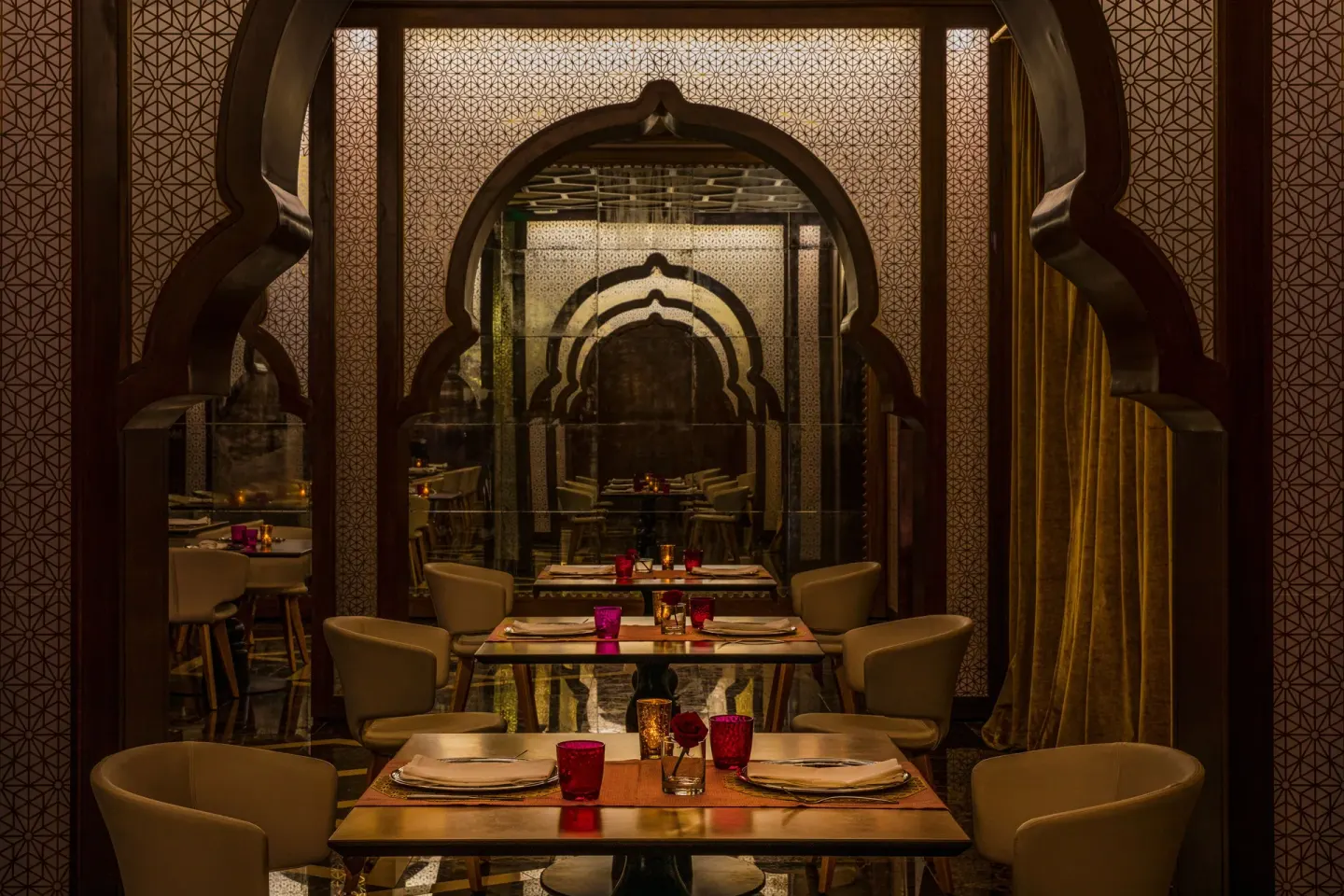 Indian-style dining room with arched wood details at Excellence Riviera Cancun.