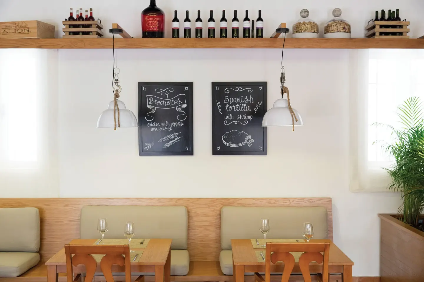 Spanish tapas-style dining nook with chalkboard menus at Excellence Riviera Cancun.