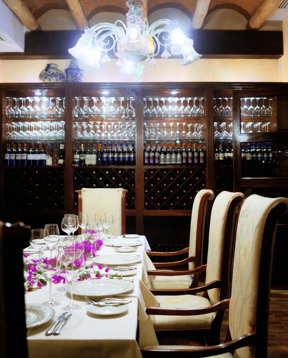 Private wine room table set for dining at Excellence Riviera Cancun.