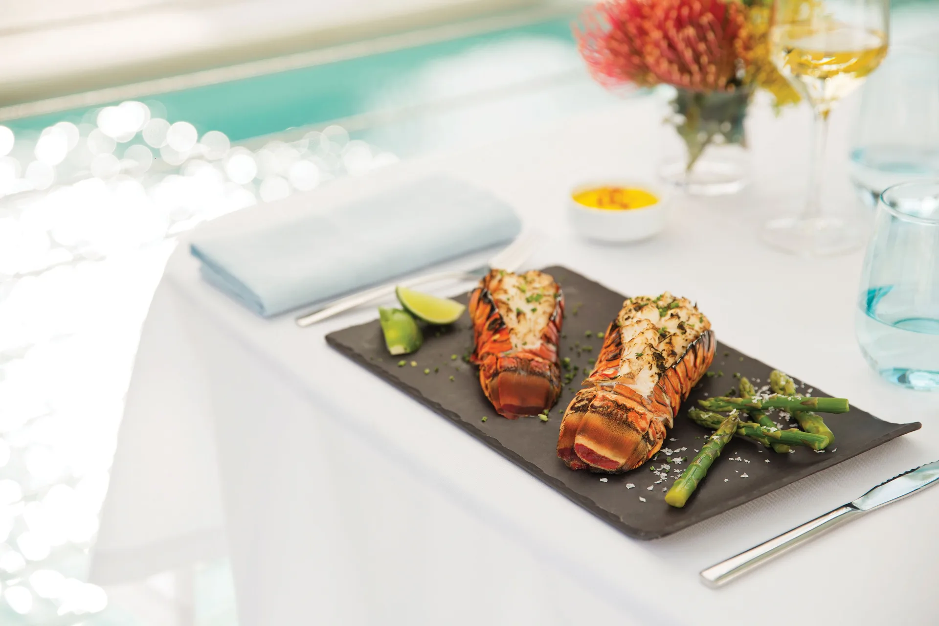 Grilled lobster tails served poolside at Excellence Riviera Cancun.