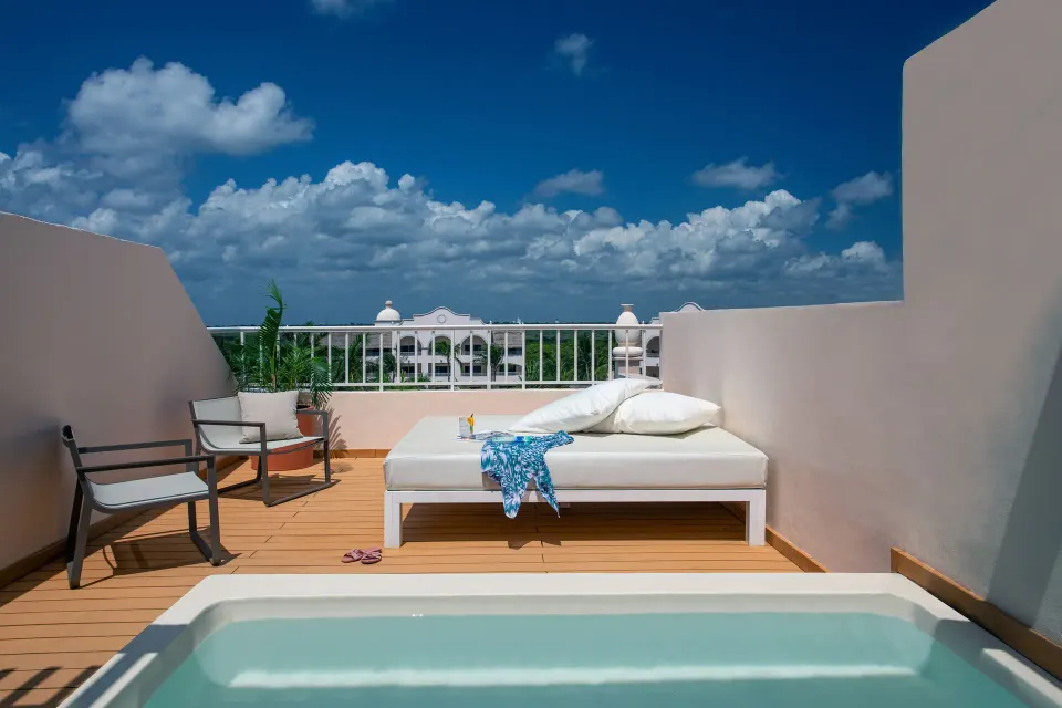 Rooftop terrace suite plunge pool and daybed at Excellence Riviera Cancun.