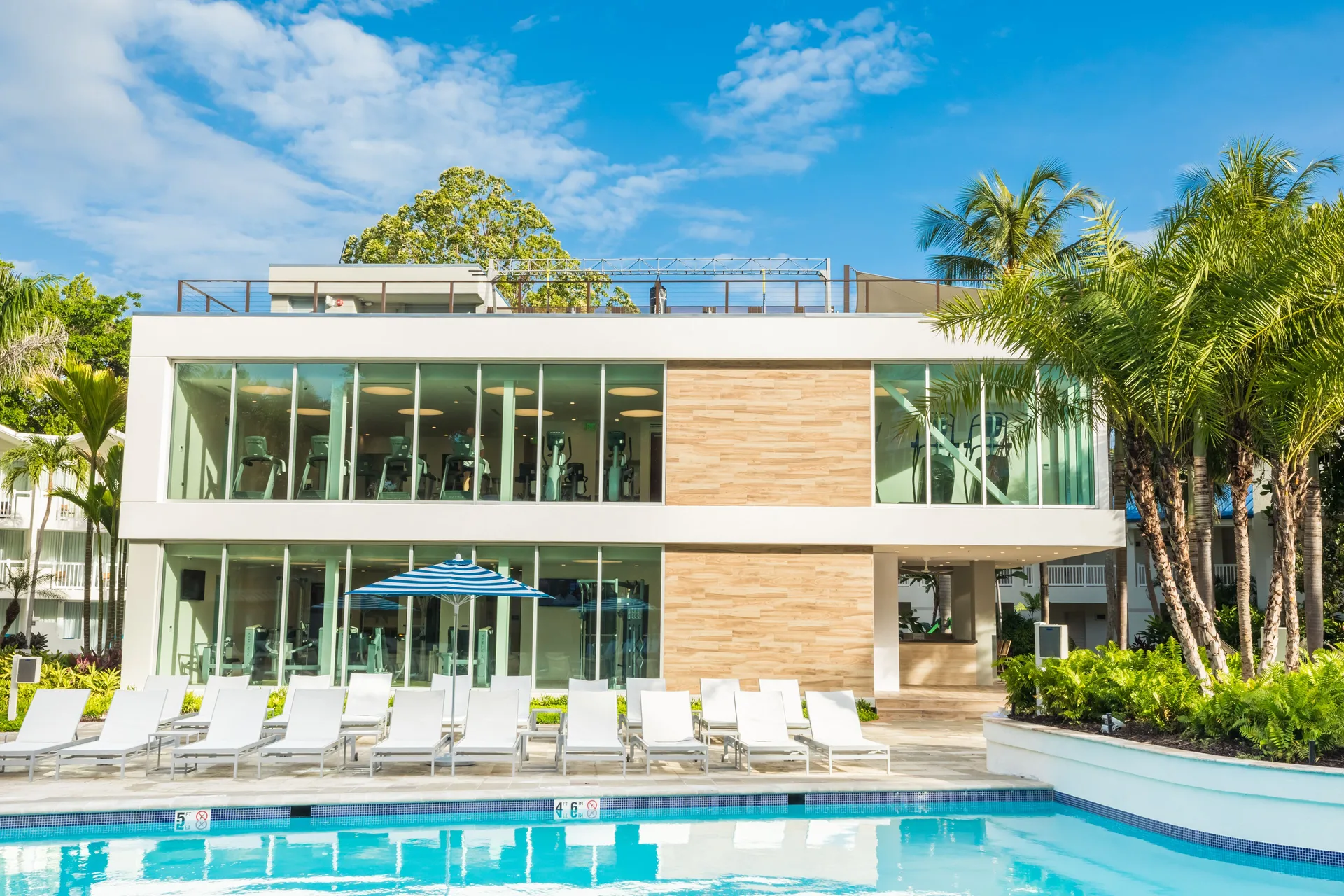 Fitness building and poolside loungers at Fairmont El San Juan.