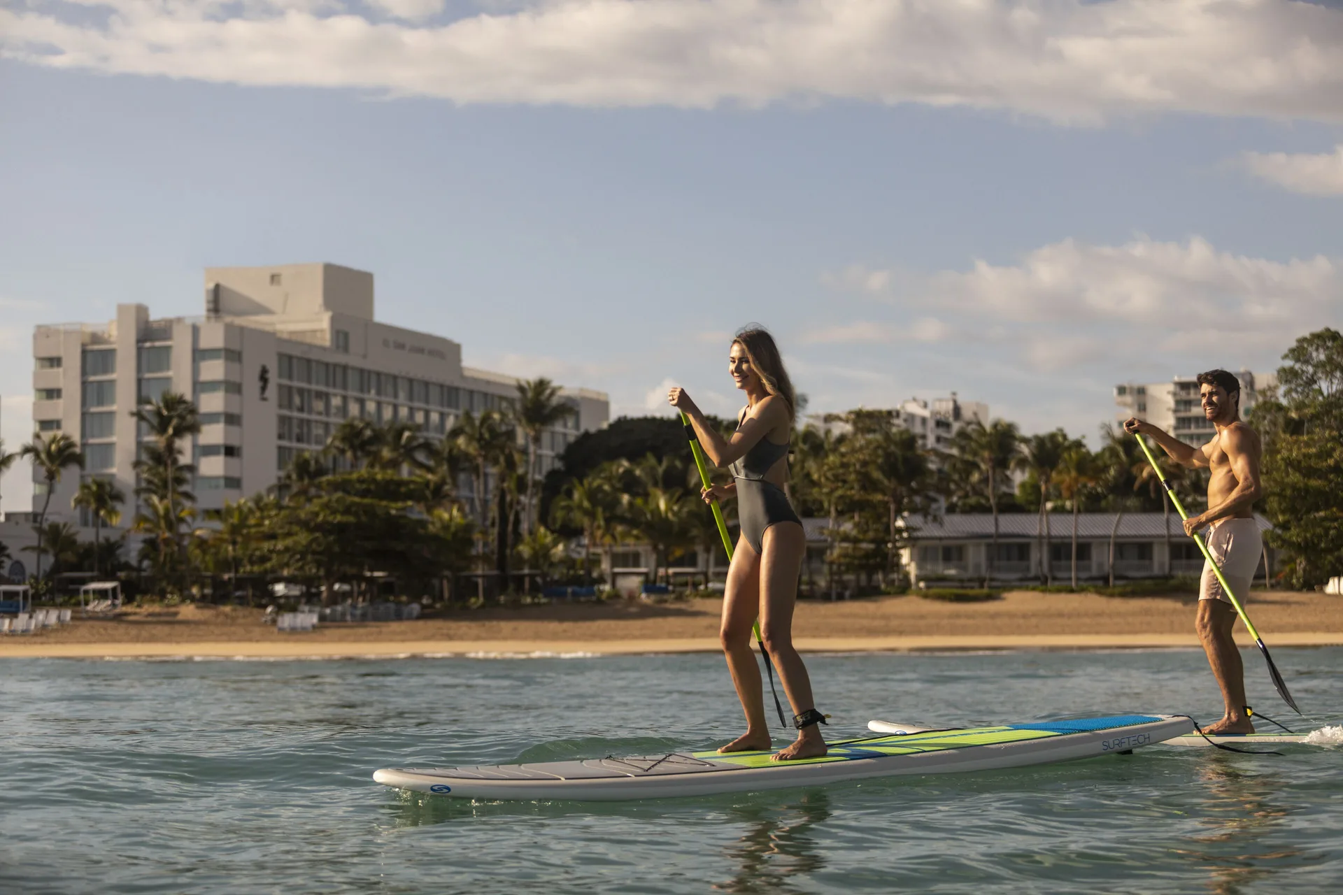 Paddleboarders glide on the water off Fairmont El San Juan.
