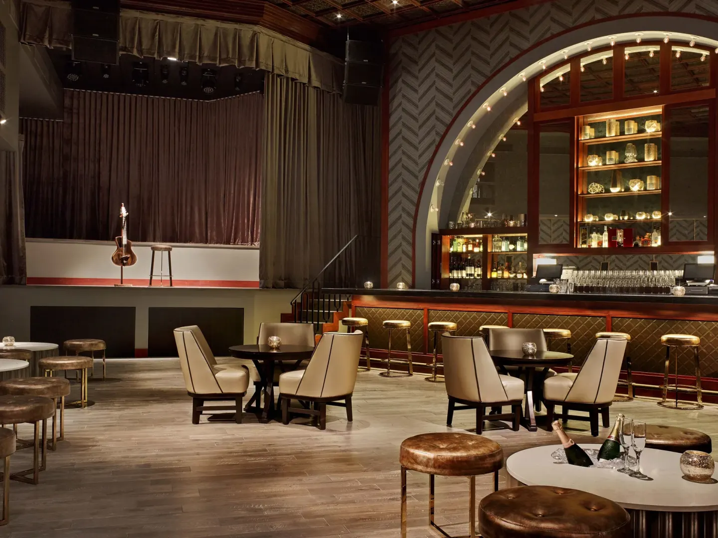 Cabaret lounge with stage, bar, and table seating at Fairmont El San Juan.
