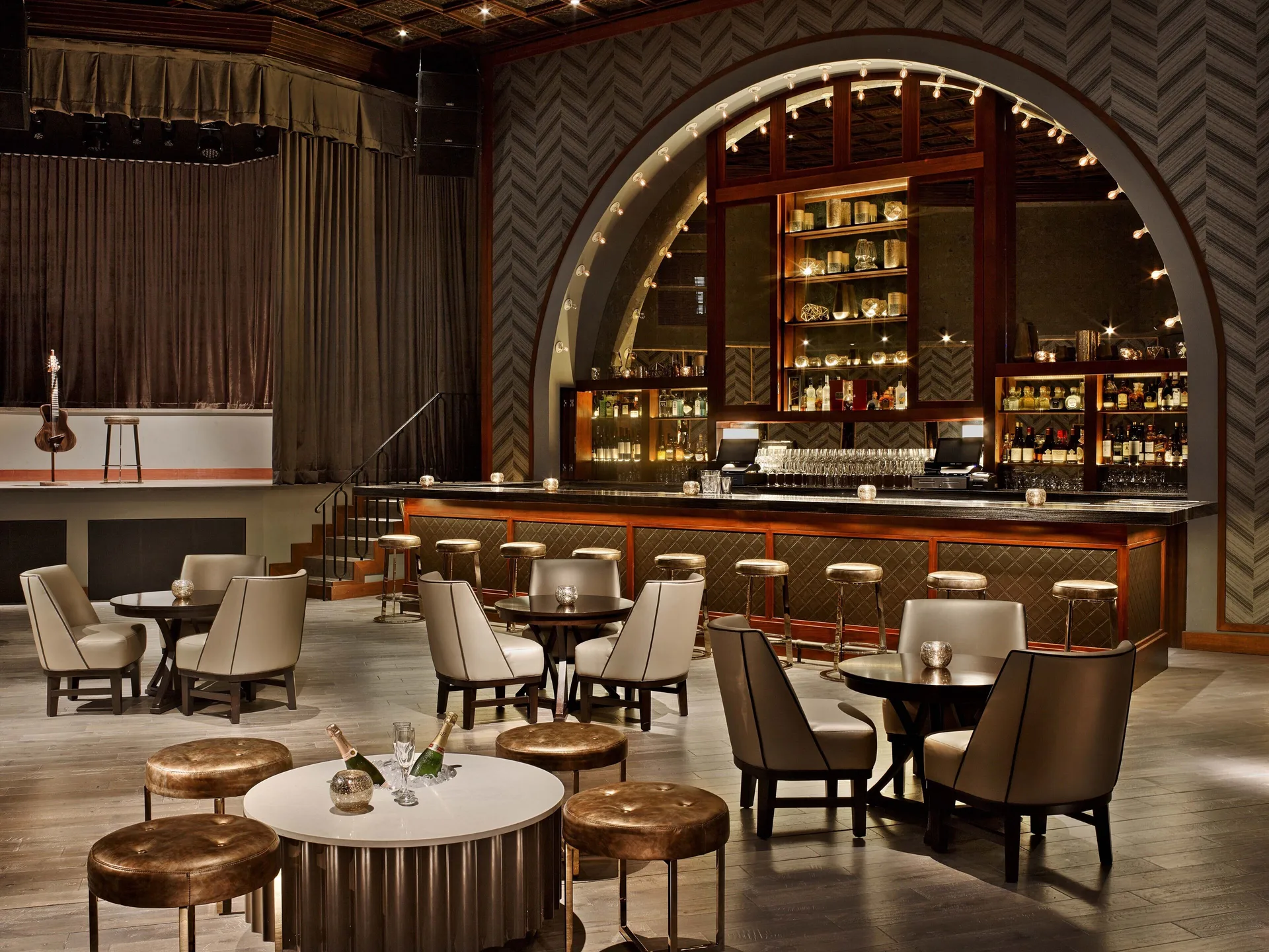 Cabaret lounge with stage, bar, and tables at Fairmont El San Juan.