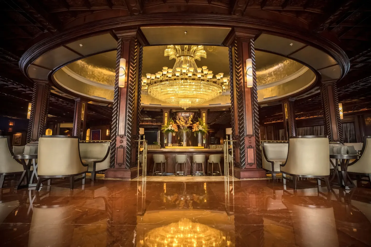 Ornate lobby bar with chandeliers and polished floors at Fairmont El San Juan.