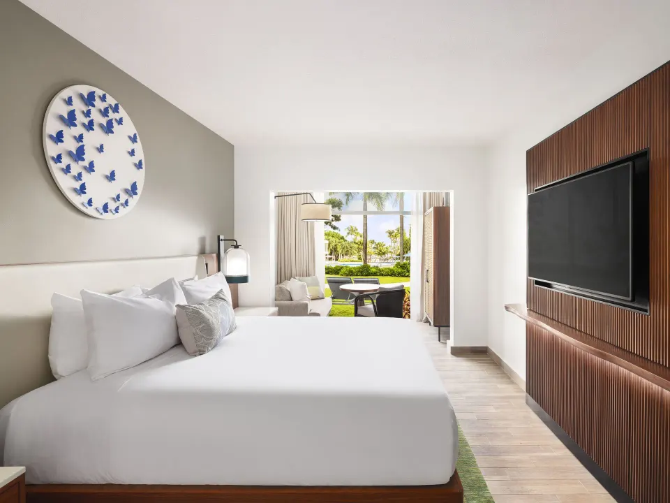 Bungalow Terrace guest room with king bed and garden patio at Fairmont El San Juan.