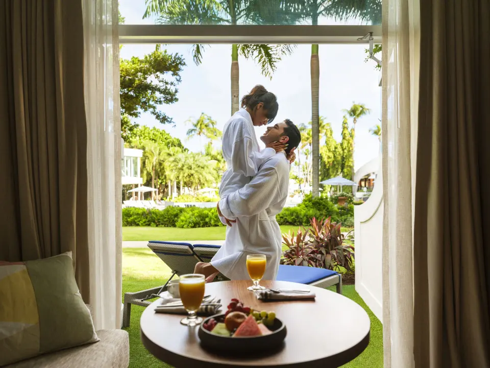 Bungalow Terrace patio with breakfast table and loungers at Fairmont El San Juan.