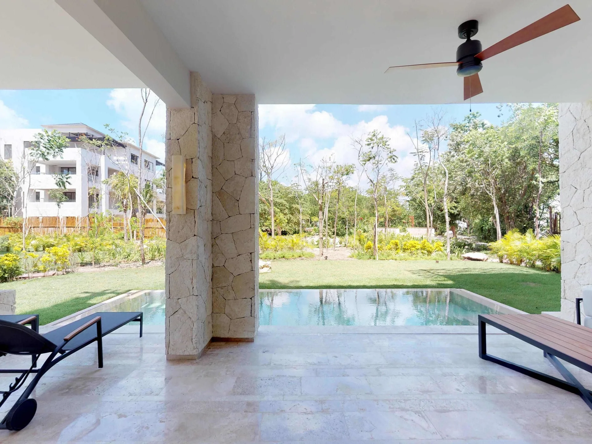 Covered terrace with plunge pool and lounge chairs at Fairmont Heritage Place Mayakoba.
