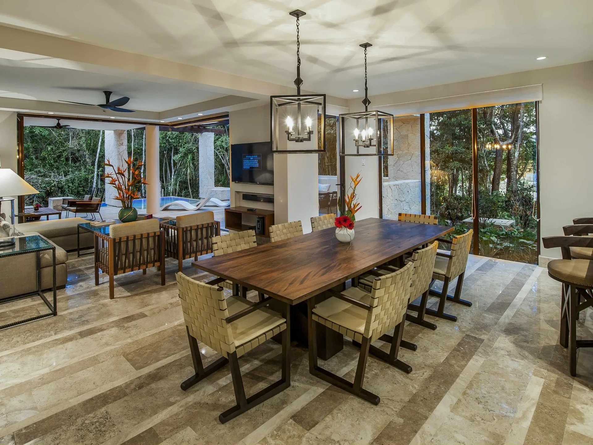 Dining and living area with terrace pool at Fairmont Heritage Place Mayakoba.