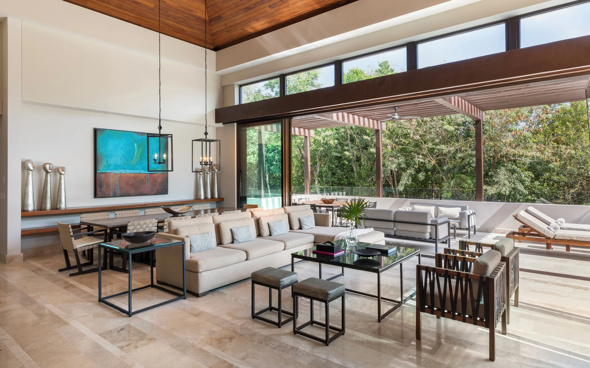 Open living room and terrace at Fairmont Heritage Place Mayakoba.