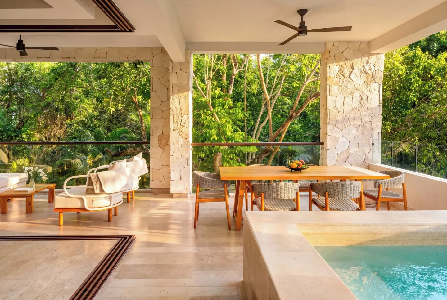 Covered villa terrace with plunge pool and dining table at Fairmont Heritage Place Mayakoba.