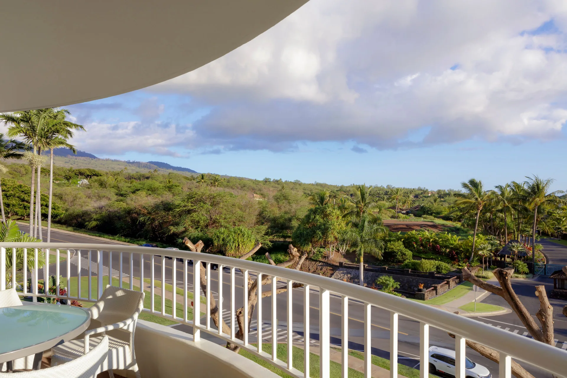 Fairmont Kea Lani Maui balcony with table, chairs and garden view at Fairmont Kea Lani Maui.