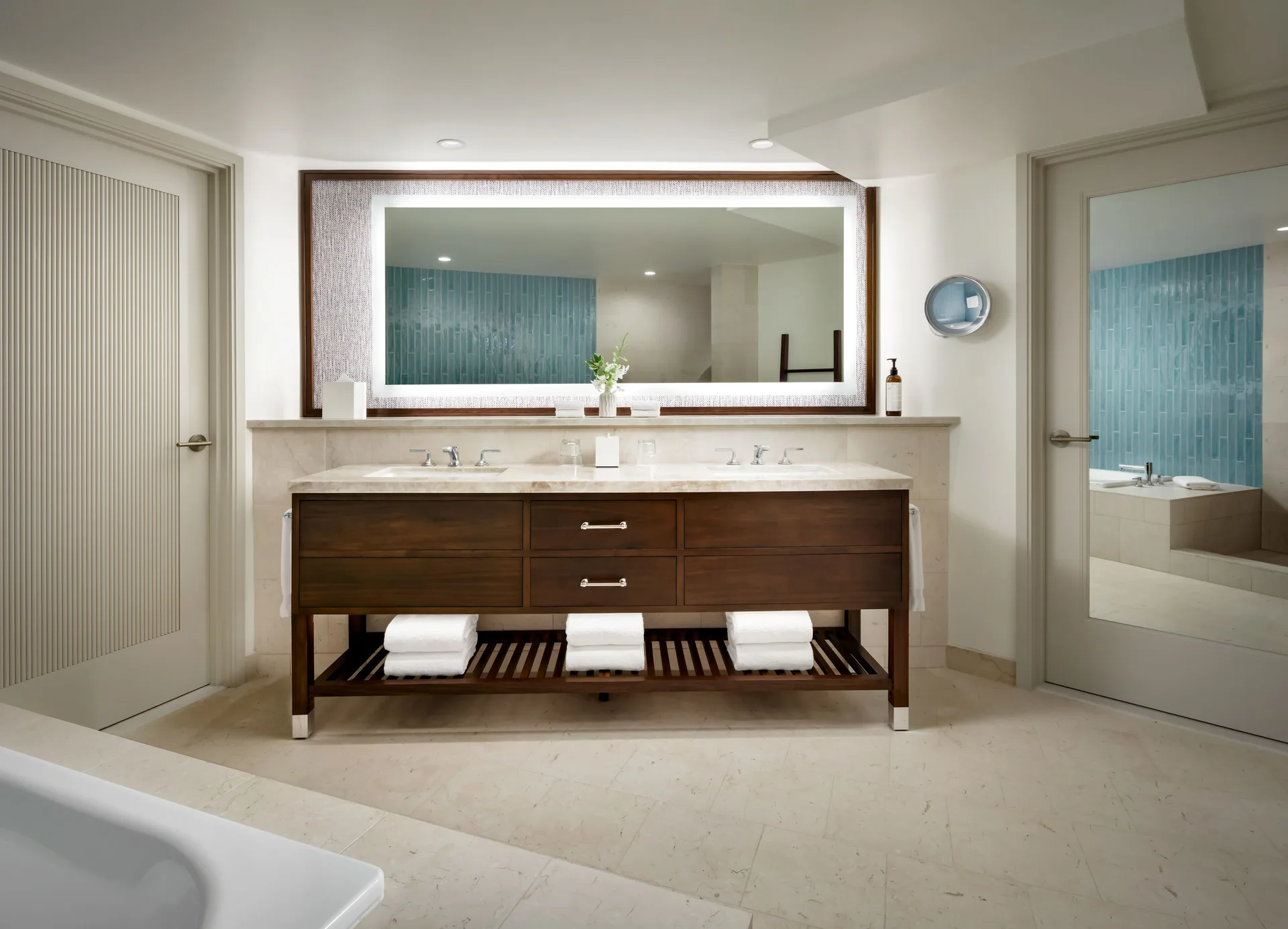 Fairmont Kea Lani Maui bathroom with double vanity and large mirror at Fairmont Kea Lani Maui.
